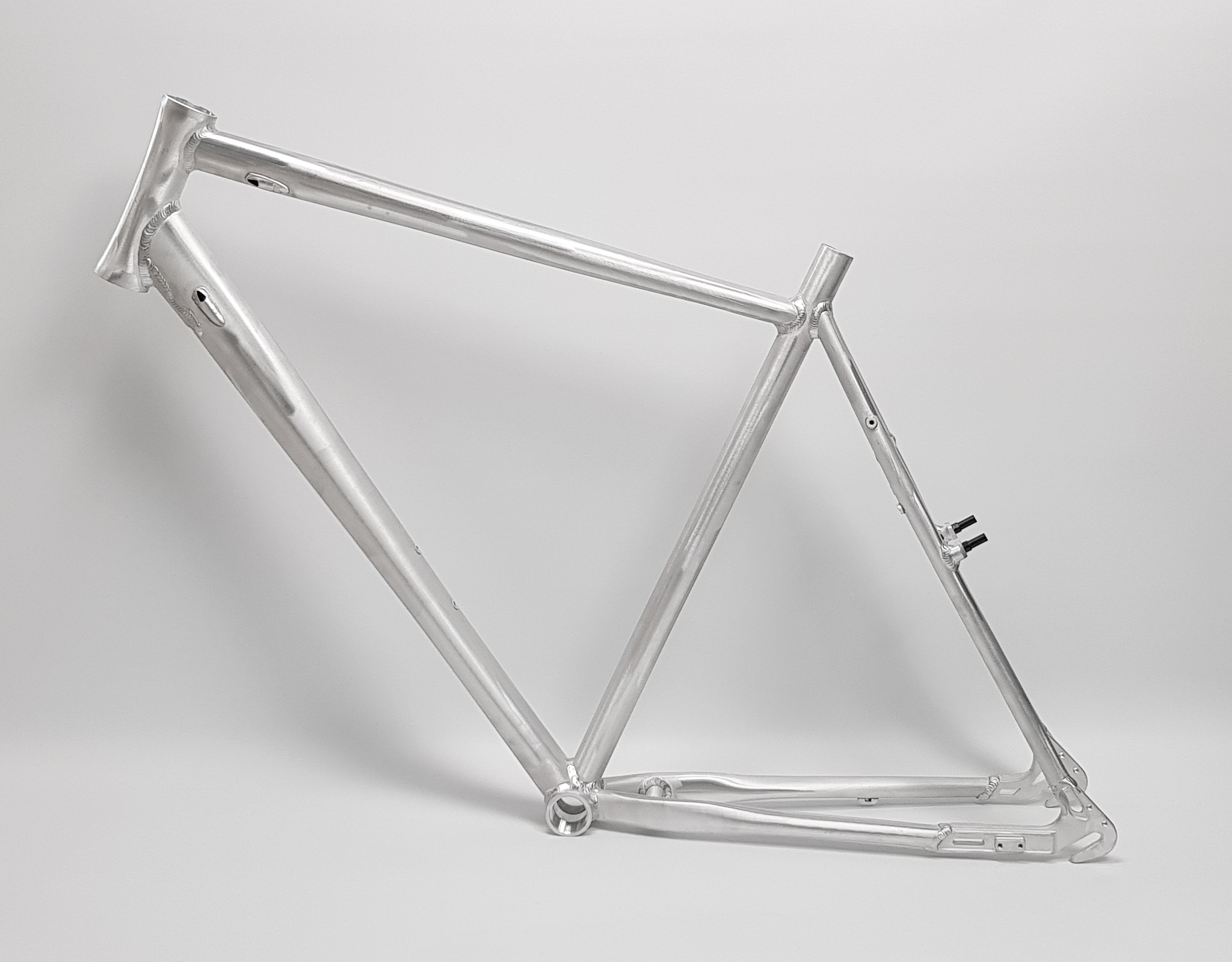 28" CNC Tour One Nexus/SS Rahmen 58 cm raw silber